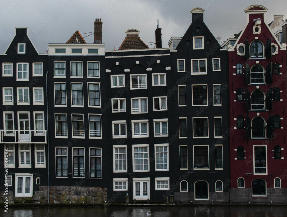 Bllack houses in Amsterdam, canal.