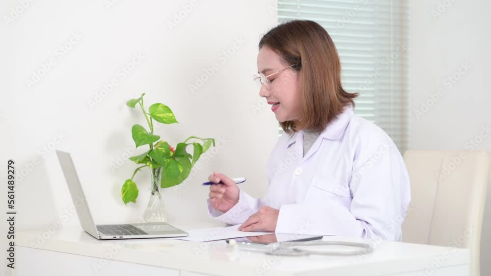 Asian doctor talking with patient via laptop computer, Medical online Asian doctor talking with patient via laptop computer, Medical online
