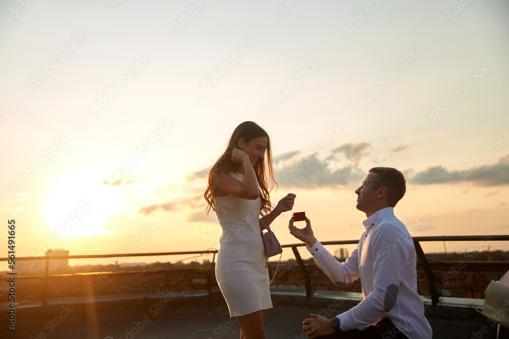 Young couple is getting engaged, man propose woman, new family celebration, engagement ring, jewellery - obrazy, fototapety, plakaty 