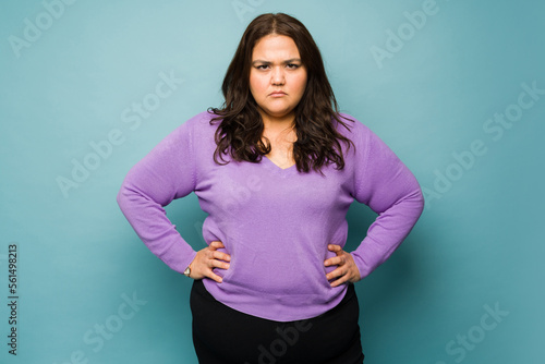 Foto Upset big woman with annoying problems