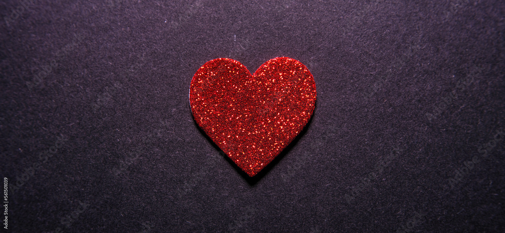 Obraz premium red heart on black background