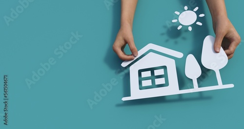 hands holding paper house, family home, homeless shelter, international day of families, foster home care, family day care, social distancing, stay at home, housing mortgage crisis concept photo