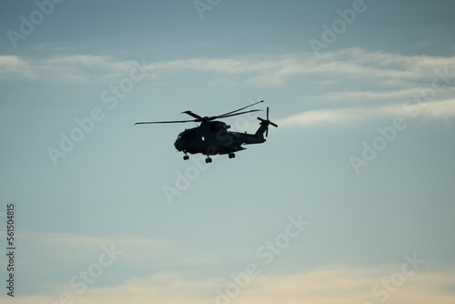 Fototapeta Naklejka Na Ścianę i Meble -  silhouette of British Joint Helicopter Command (JHC) Royal Air Force Puma HC2 on a military exercise, winter sky, Wiltshire UK