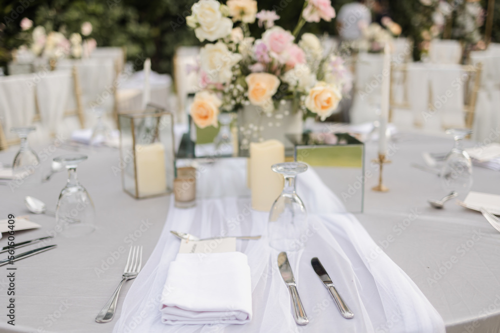 Beautiful table setting with tableware, flowers, candles and accessories for a party, wedding reception, gala banquet or other holiday event. Beautiful table setting with tableware, flowers, candles and accessories for a party, wedding reception, gala banquet or other holiday event.