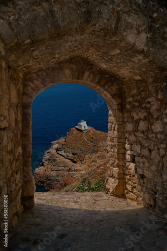 Small church through old castle on Sifnosi island, Greece