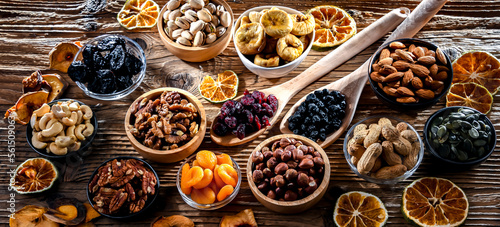 Composition with a variety of dried fruits and assorted nuts.