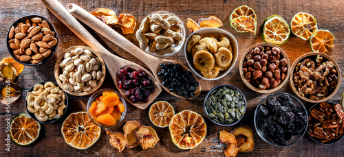 Composition with a variety of dried fruits and assorted nuts.