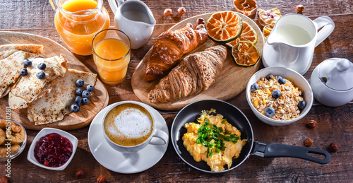 Breakfast served with coffee, eggs, cereals nd croissants