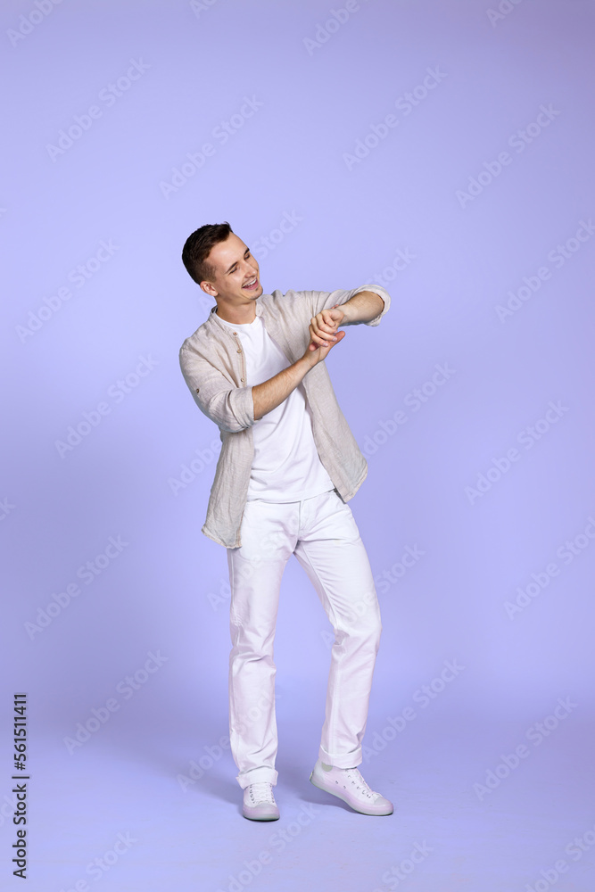 man in casual shirt posing on purple background. man in casual shirt posing on purple background.