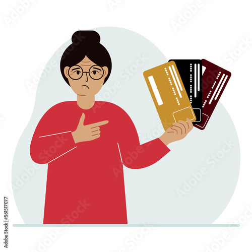 A woman with several plastic cards. The concept of multiple loans, the burden of credit cards and banking fees over a lifetime.