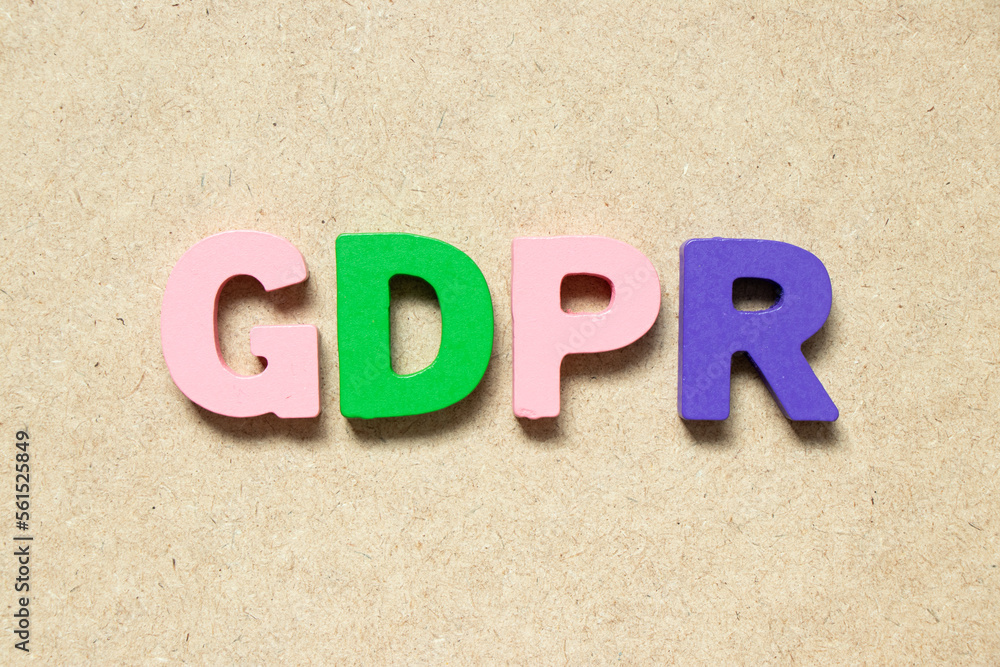Color alphabet letter in word GDPR (General Data Protection Regulation) on wood background
