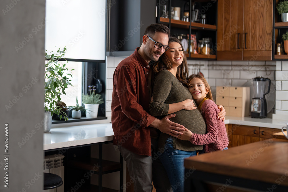 Cropped shot of an unrecognizable man, young child and woman touching her pregnant belly. Family love and support during pregnancy. Cropped shot of an unrecognizable man, young child and woman touching her pregnant belly. Family love and support during pregnancy.