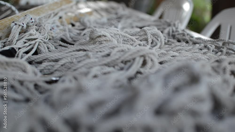 white bondage rope on a leather table. bdsm rope for bondage sex. white bondage rope on a leather table. bdsm rope for bondage sex.
