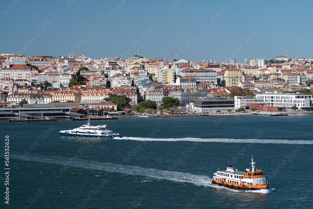 Water transportation in Lisboa. Ferry and boat crossing Tagus river. Vacation, travel concept