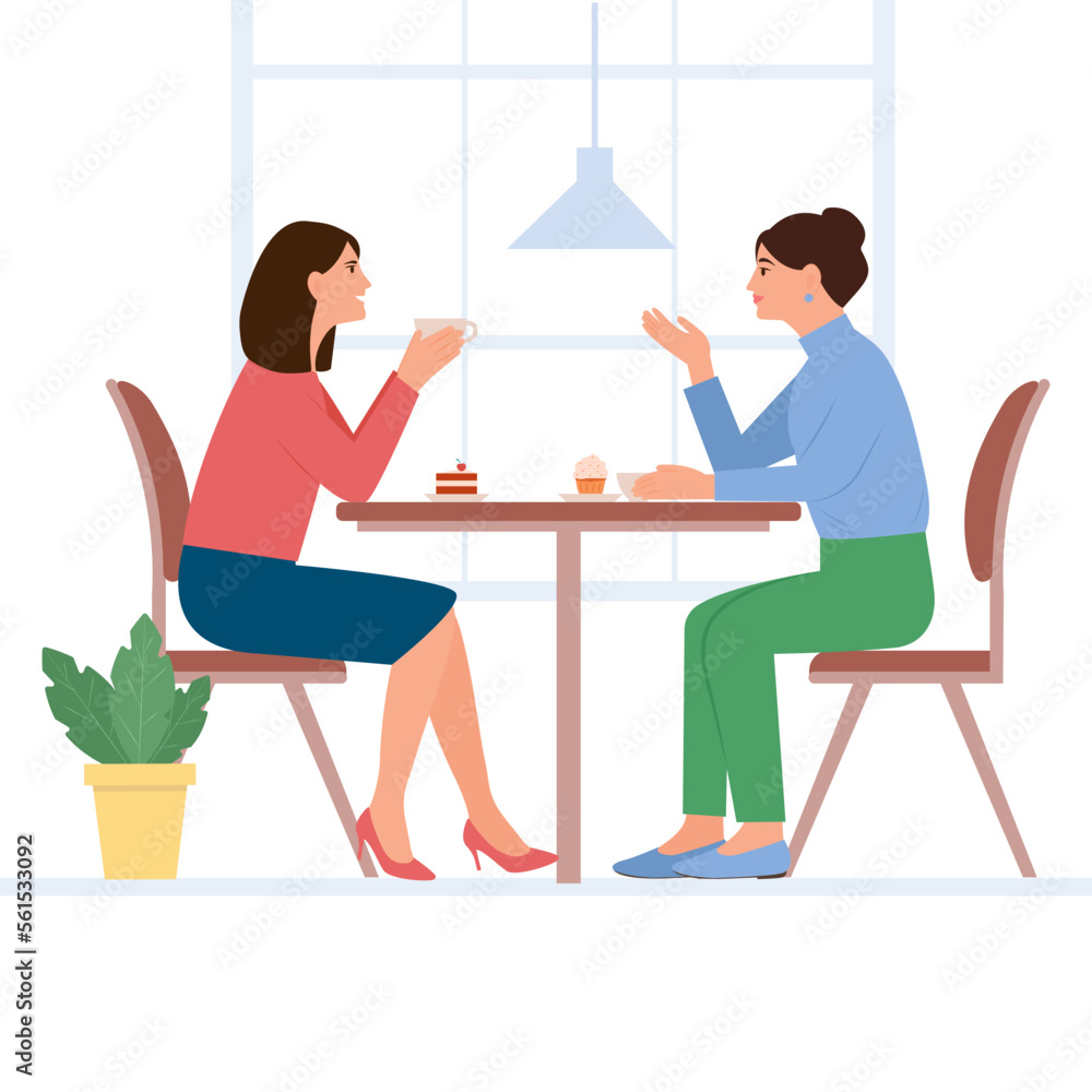 .Smilling women sit at the table and chat in a cafe. Female friends drinking tea ot coffee together. People enjoying coffee break in public place, having tea in restaurant,conversation, eating. 