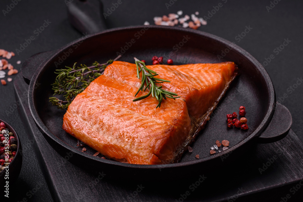 Delicious baked salmon red fish steak with spices and herbs Delicious baked salmon red fish steak with spices and herbs