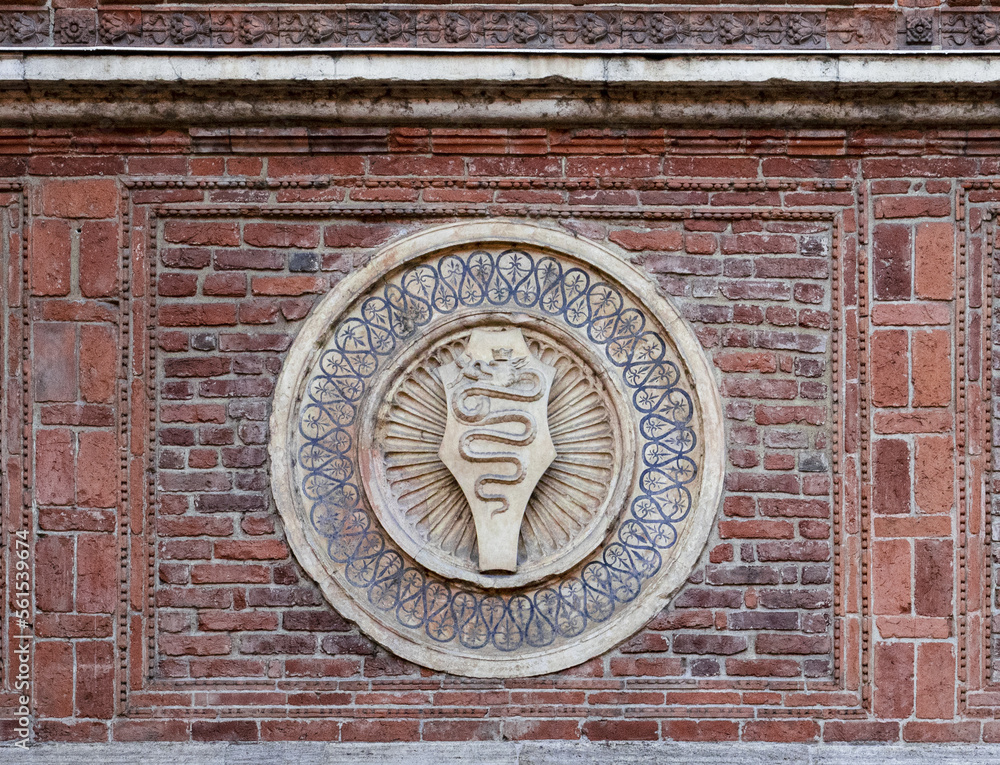Medieval symbol of the city on the wall of the ancient basilica Santa Maria delle Grazie.Milan,Italy. Medieval symbol of the city on the wall of the ancient basilica Santa Maria delle Grazie.Milan,Italy.