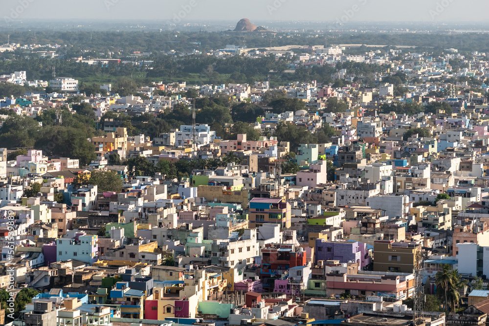 Aerial view of the low rise rooftops and cityscape of the city of Tiruchirappalli in Tamil Nadu in South India.
