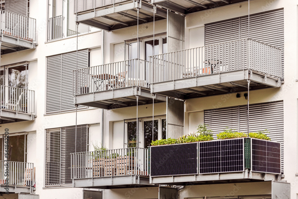 Solar Panel on Balcony of Modern Residential Building in Germany. Modern Facade Apartment Building with Solar panels on Flat Balcony. - obrazy, fototapety, plakaty 