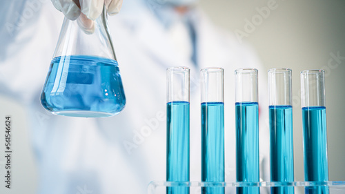 Scientist experimental in laboratory with test tube and beaker for medical research