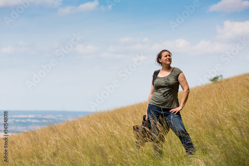 woman standing at hillside in a meadow   © bmf-foto.de