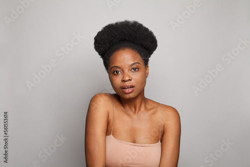  Young model woman with fresh clean skin on white. Beauty, facial treatment, skin care and cosmetology concept