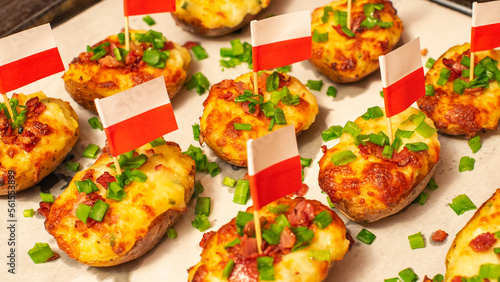Twice-baked potatoes stuffed with mashed potato filling and topped with mozzarella cheese, fried crispy bacon, and chopped chives. Jacket potatoes