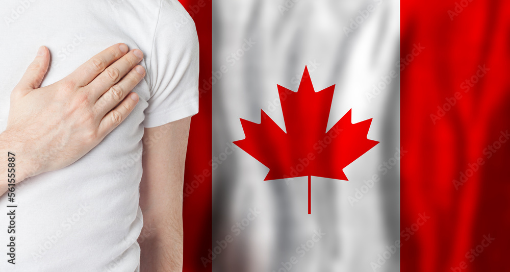 Canadian person with hand on heart on the background of Canada flag. Patriotism, country, national, pride concept - obrazy, fototapety, plakaty 