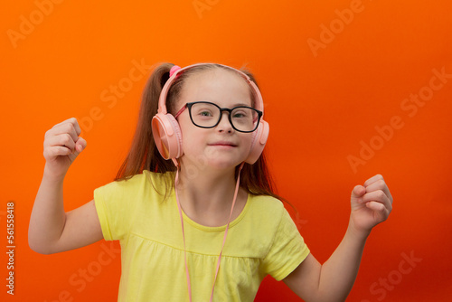 Girl with Down syndrome listens to music