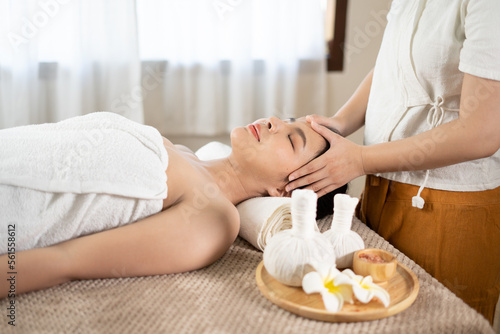 Young Asian beauty woman enjoying massage and spa.