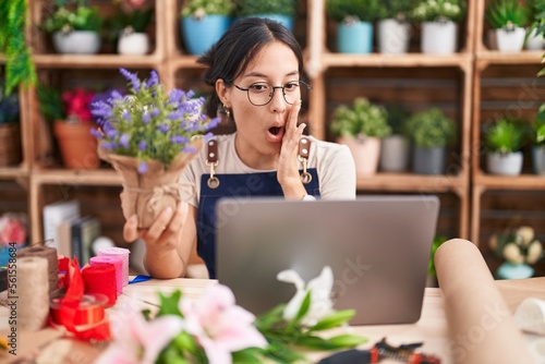 Wallpaper Mural Young hispanic woman working at florist shop doing video call afraid and shocked, surprise and amazed expression with hands on face Torontodigital.ca