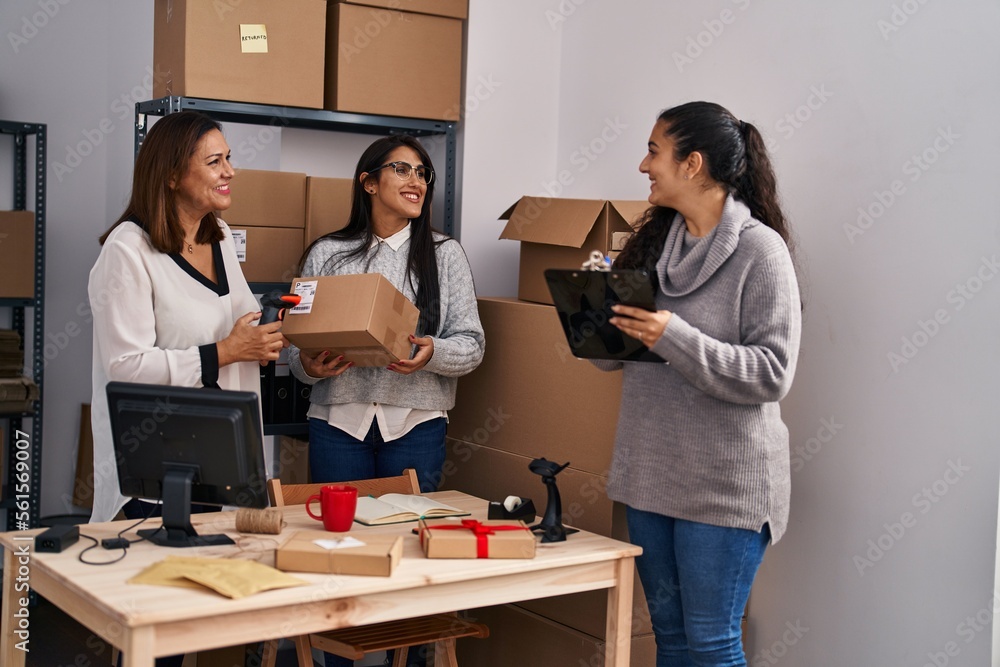 Three woman ecommerce business workers scanning package working at office Three woman ecommerce business workers scanning package working at office