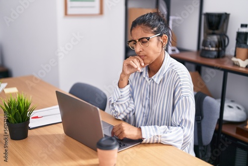 Young beautiful hispanic woman business worker using laptop working at office