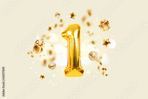 Foto Golden number 1 is flying with golden confetti, gifts, mirror ball and stars balloons on a beige background with bokeh lights and sparks, creative idea