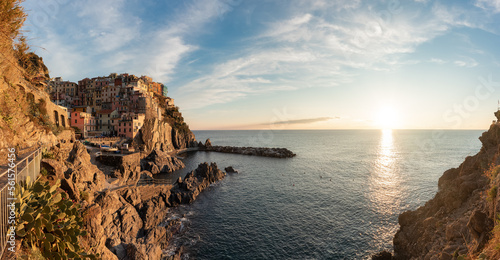 Small touristic town on the coast, Manarola, Italy. Cinque Terre. Colorful Sunny Sunset Fall Season. Panorama