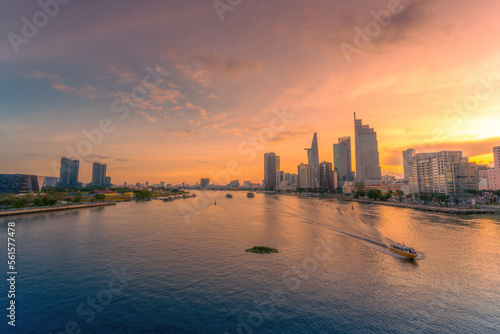 Wallpaper Mural Aerial sunset view of Bitexco Tower, buildings, roads, Bason bridge and Saigon river in Ho Chi Minh city, container cargo ship on Saigon river. Travel concept. Torontodigital.ca