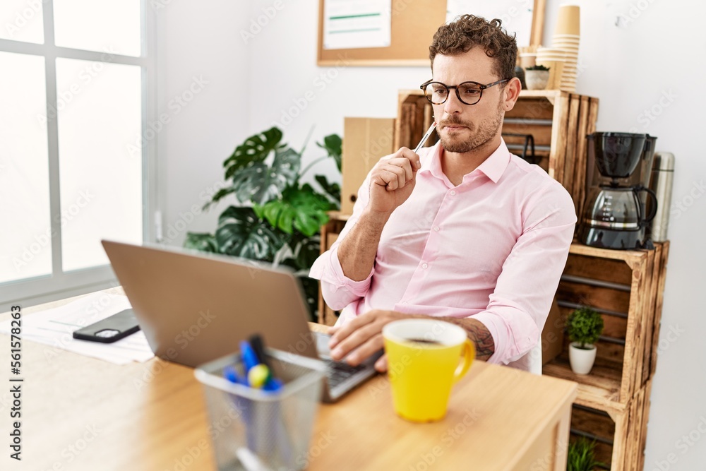 Young hispanic man working concentrate at office Young hispanic man working concentrate at office