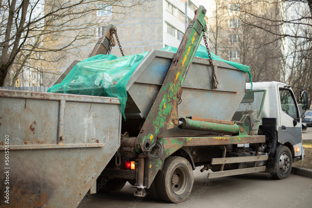 Garbage collection. Transport for collection of containers with waste.