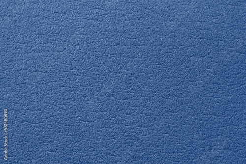 Soft surface mat for gymnastics. Blue background with texture. Synthetic material. Photo closeup