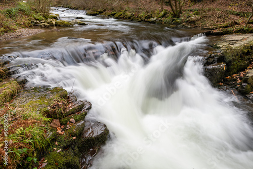 Long exposure of the Watersmeet Bridge waterfall at Watersmeet in Exmoor National Park