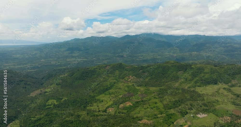 Aerial drone of slopes of mountains and hills with forest and farmland. Negros, Philippines Aerial drone of slopes of mountains and hills with forest and farmland. Negros, Philippines