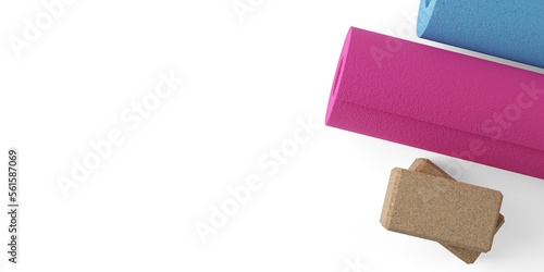 Two stacked yoga or pilates blocks made from natural cork with two yoga or pilates mats over white background with copy space