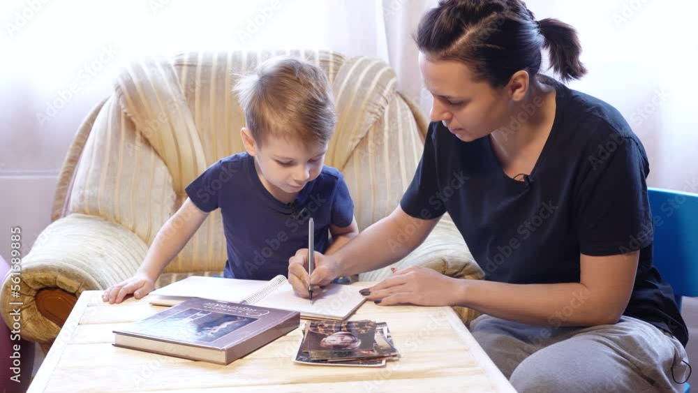 Mom and son draw and record interviews while looking at photos Mom and son draw and record interviews while looking at photos