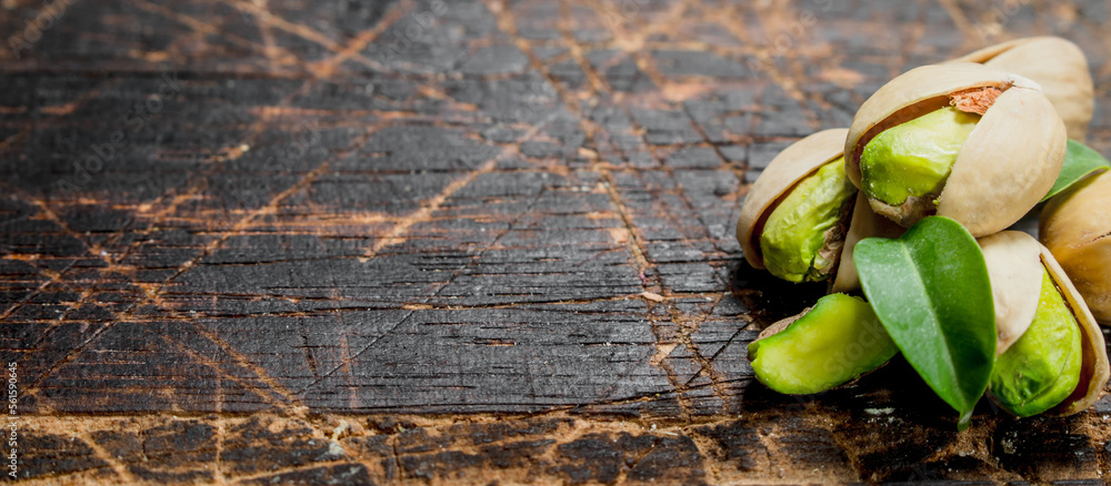 Pistachios with green leaves . Pistachios with green leaves .