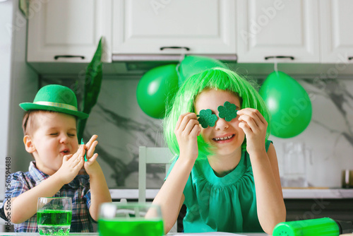 Two toddler boy and girl celebrate the holiday on March 17. Child celebrate St. Patrick's Day. Traditions, holidays concept.
