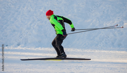 Winter sports for health, Athlete trains cross country skiing on snow, sunny morning day