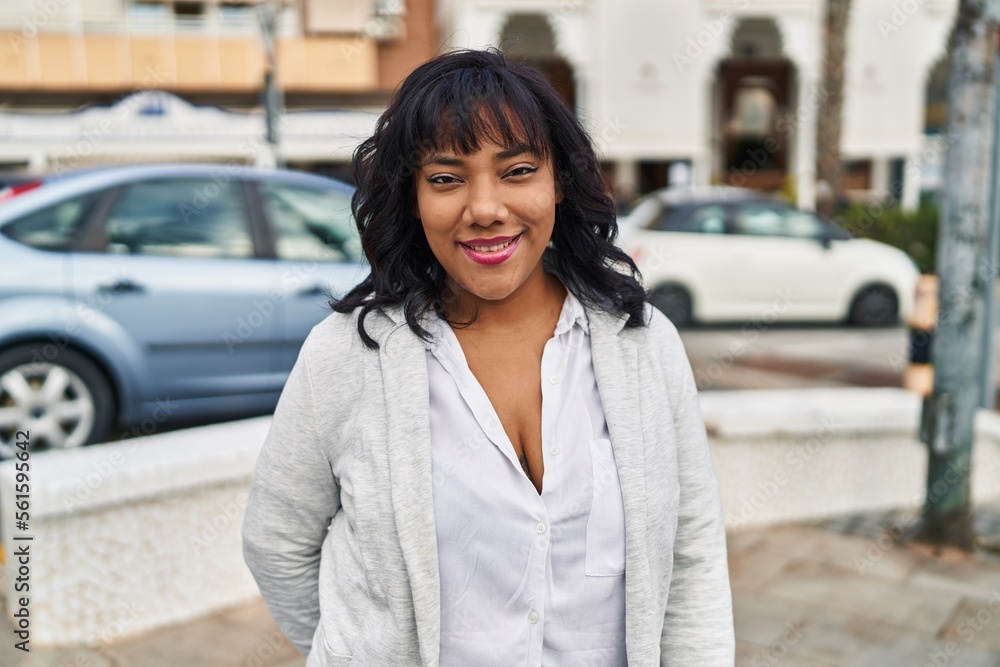 Young beautiful latin woman smiling confident standing at street Young beautiful latin woman smiling confident standing at street