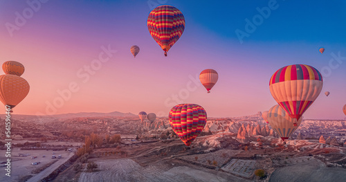 Romantic vacation Goreme national park, color hot air balloons fly, Amazing sunrise Cappadocia. Turkey travel Concept, aerial view photo