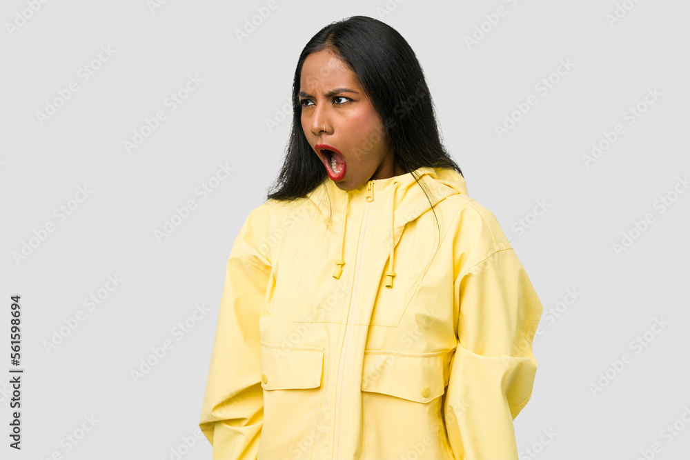 Young Indian woman cut out isolated on white background shouting very angry, rage concept, frustrated. Young Indian woman cut out isolated on white background shouting very angry, rage concept, frustrated.