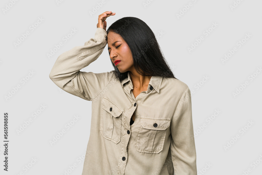 Young Indian woman cut out isolated on white background forgetting something, slapping forehead with palm and closing eyes. Young Indian woman cut out isolated on white background forgetting something, slapping forehead with palm and closing eyes.